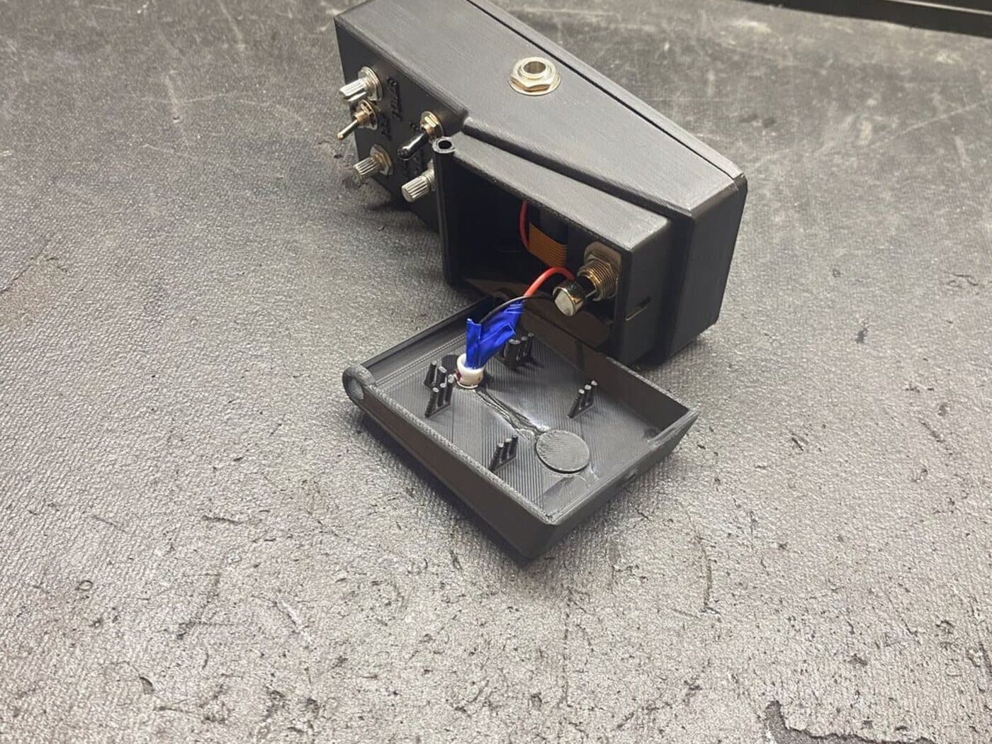 The pedal with the enclosure opened up
